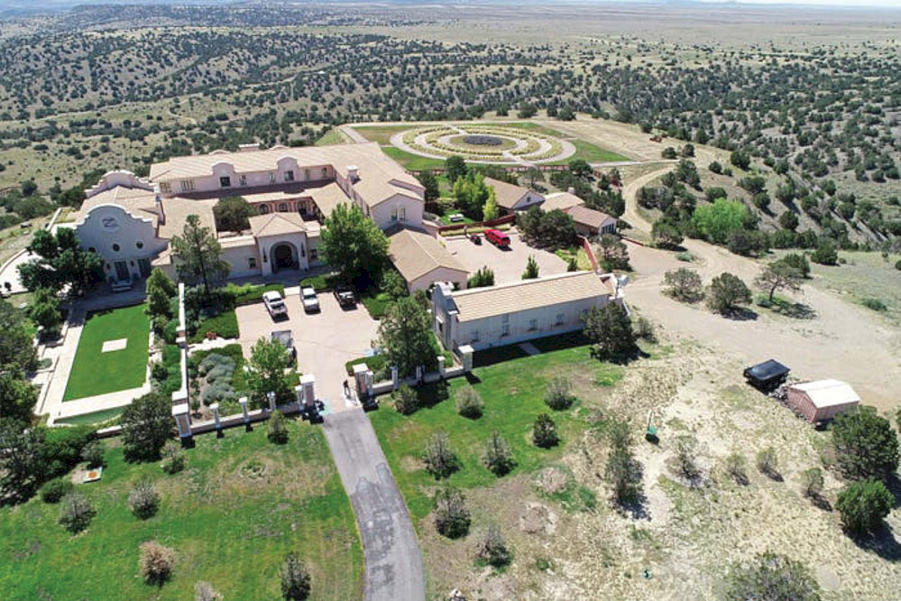 GX 706 page1 Zorro Ranch, NM Aerial view of a large mansion in the middle of the desert